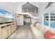 Bright living room boasting high ceilings, staircase and open space that offers comfort and style at 7330 Westmoreland Dr, Sarasota, FL 34243