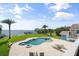Gorgeous waterfront home with a custom pool, spa, and lounge area for relaxation at 7330 Westmoreland Dr, Sarasota, FL 34243