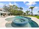 Luxury backyard featuring a custom pool with spa, lush landscaping, and waterfront access at 7330 Westmoreland Dr, Sarasota, FL 34243