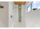 Modern tiled walk-in shower with a ceiling-mounted rainfall showerhead and built-in bench at 7330 Westmoreland Dr, Sarasota, FL 34243