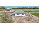 New single-story home with neutral exterior, covered entryway, and future landscaping at 7561 Nighthawk Dr, Sarasota, FL 34241
