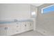 New bathroom featuring a white marble tile shower and white cabinetry at 7561 Nighthawk Dr, Sarasota, FL 34241