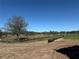 Scenic vacant land awaiting construction, surrounded by lush greenery under a clear blue sky at 7561 Nighthawk Dr, Sarasota, FL 34241