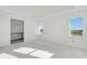 Spacious main bedroom featuring an ensuite bathroom and large windows for natural light at 7561 Nighthawk Dr, Sarasota, FL 34241