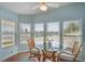 Charming dining area with scenic lake views from three windows, creating a serene space at 759 Lakeside Dr, North Port, FL 34287