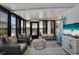 Enclosed lanai with comfortable seating offering serene waterfront views and relaxation space at 759 Lakeside Dr, North Port, FL 34287