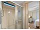Bathroom includes a tiled shower with glass doors and a door to the bedroom at 772 Imperial Dr, North Port, FL 34287