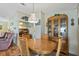 Comfortable dining area with wooden table and chairs, complemented by a china cabinet, and plenty of space at 772 Imperial Dr, North Port, FL 34287