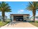 Exterior view of home featuring covered parking, seating area, and golf cart at 772 Imperial Dr, North Port, FL 34287