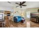 Open concept living room with hardwood floors, dining area, and kitchen for easy living and entertaining at 772 Imperial Dr, North Port, FL 34287