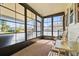 Enclosed sunroom with plenty of windows, creating a bright and inviting space to relax at 772 Imperial Dr, North Port, FL 34287