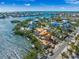Expansive aerial view showcasing coastal new construction with a private dock, scenic waterfronts, and a vibrant community at 821 S Bay Blvd, Anna Maria, FL 34216