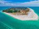 Breathtaking aerial view of a coastal community with pristine white beaches and turquoise water at 821 S Bay Blvd, Anna Maria, FL 34216