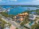 Breathtaking aerial view of coastal construction, overlooking a harbor, marina, and the picturesque neighborhood at 821 S Bay Blvd, Anna Maria, FL 34216