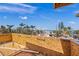 Balcony view showcasing the blue sky, palm trees, and neighboring homes at 821 S Bay Blvd, Anna Maria, FL 34216