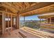 Unfinished balcony featuring scenic view of a bay with boats framed by surrounding trees at 821 S Bay Blvd, Anna Maria, FL 34216