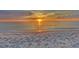 Beautiful sunset over the Gulf of Mexico with calm waters and a sandy beach at 821 S Bay Blvd, Anna Maria, FL 34216
