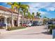 Shopping center with palm trees and parking area in Anna Maria Island, Florida at 821 S Bay Blvd, Anna Maria, FL 34216