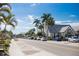 Street view with palm trees, parked cars, and a charming church in Anna Maria Island at 821 S Bay Blvd, Anna Maria, FL 34216