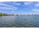 A serene waterfront view showcasing calm waters, boats docked at the marina, and clear skies, perfect for relaxation and enjoyment at 821 S Bay Blvd, Anna Maria, FL 34216