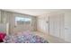 Bright bedroom featuring a window view, spacious closets, and comfortable carpet flooring at 8625 Midnight Pass Rd # 305B, Siesta Key, FL 34242