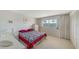 This bedroom is bright and open with a window and large closet at 8625 Midnight Pass Rd # 305B, Sarasota, FL 34242