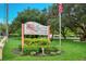 Inviting sign for Bay Tree Club with lush landscaping, marking A, B, and C buildings at 8625 Midnight Pass Rd # 305B, Sarasota, FL 34242