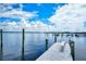 Community dock with seating area, offering stunning views and access to waterfront activities at 8625 Midnight Pass Rd # 305B, Siesta Key, FL 34242