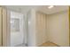 Hallway featuring multiple storage closets and an entrance to a bedroom at 8625 Midnight Pass Rd # 305B, Siesta Key, FL 34242