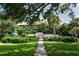 Landscaped pool area with a gate for access at 8625 Midnight Pass Rd # 305B, Siesta Key, FL 34242