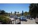 Outdoor picnic area with tables, umbrellas and BBQ grills are ready for community gatherings and enjoyment at 8625 Midnight Pass Rd # 305B, Siesta Key, FL 34242