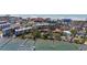 Aerial view showcasing the property, boat slips, and nearby homes at 8625 Midnight Pass Rd # 305B, Siesta Key, FL 34242