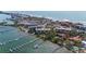 Aerial view of condo complex located on the water with boat docks and waterfront access at 8625 Midnight Pass Rd # 305B, Siesta Key, FL 34242