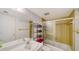 Bathroom featuring classic fixtures, a vanity with storage, and a shower-tub combination at 8625 Midnight Pass Rd # 305B, Siesta Key, FL 34242