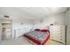 Comfortable bedroom showcases a calming atmosphere, soft carpet, and bright natural light at 8625 Midnight Pass Rd # 305B, Siesta Key, FL 34242