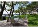 Community outdoor seating area with beautiful waterfront views at 8625 Midnight Pass Rd # 305B, Siesta Key, FL 34242