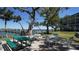Inviting waterfront outdoor seating area with picnic tables and lovely views of the pier at 8625 Midnight Pass Rd # 305B, Siesta Key, FL 34242