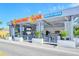 Modern drive-up liquor store and restaurant with outdoor seating and stylish design at 8625 Midnight Pass Rd # 305B, Siesta Key, FL 34242