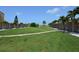 Row of community storage units on lush green lawn at 8625 Midnight Pass Rd # 305B, Siesta Key, FL 34242