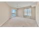 A large bedroom featuring a sliding glass door with a balcony at 10520 Boardwalk Loop # 503, Bradenton, FL 34202