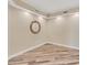 A bedroom with unique wood-look tile flooring and neutral walls at 10520 Boardwalk Loop # 503, Bradenton, FL 34202