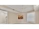 A bedroom with a ceiling fan, artwork, and a spacious closet at 10520 Boardwalk Loop # 503, Bradenton, FL 34202