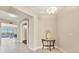 Inviting entryway with neutral tones, tile flooring, and an elegant console table with decor at 10520 Boardwalk Loop # 503, Bradenton, FL 34202