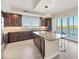 Well-appointed kitchen with stainless appliances, granite countertops, and a center island at 10520 Boardwalk Loop # 503, Bradenton, FL 34202