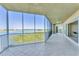 Expansive tiled lanai with ceiling fan and sliding glass doors, offering stunning views at 10520 Boardwalk Loop # 503, Bradenton, FL 34202