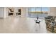Bright living room with tile floors and sliding glass doors to a balcony with a beautiful water view at 10520 Boardwalk Loop # 503, Bradenton, FL 34202
