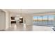 Open-concept living space with tile flooring, a modern kitchen, and access to the lanai at 10520 Boardwalk Loop # 503, Bradenton, FL 34202