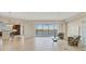 Bright living space with tile floors, leading to kitchen and lanai with beautiful water views at 10520 Boardwalk Loop # 503, Bradenton, FL 34202