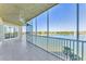 Spacious screened patio with scenic lake views and a ceiling fan at 10520 Boardwalk Loop # 503, Bradenton, FL 34202