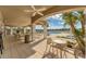 Inviting poolside patio with ample seating, shaded areas, and stunning lake views at 10520 Boardwalk Loop # 503, Bradenton, FL 34202